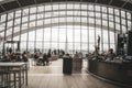 Walkie Talkie London inside the top floor sky garden contemporary rooftop restaurant with tourists eating drinking and dining