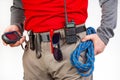 walkie-talkie, flashlight, knife, GPS navigator, climbing rope on the belt of the tourist trekking pants. equipment for tourism