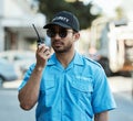 Walkie talkie, man and a security guard or safety officer outdoor on a city road with communication. Serious male person Royalty Free Stock Photo