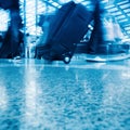 Walking airport passenger with motion blur Royalty Free Stock Photo