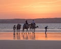 Walking along the beach at Sunset Royalty Free Stock Photo