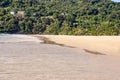 Walking along beach. Warm sand. Green Mountain