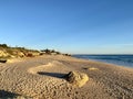 Walking along the sandy beach of Praia Da Gale in Algarve, south of Portugal