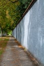 Walking along the walls of champagne house in old French city Reims in August, France