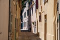 Walking on ancient french village Grimaud, touristic destination with ruines fortress castle on top, Var, Provence, France