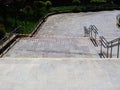 The walking area with granite tiles is surrounded by a protective tape on a sunny day. The passage is closed