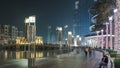 Walking area near the Dubai Fountain at night, UAE timelapse Royalty Free Stock Photo