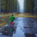 Walking in autumn rainy park Royalty Free Stock Photo