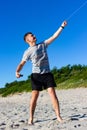 Kaliningrad, Russia - June 23, 2019: Man holding a kite at Baltic sea beach in summer day. Close up view