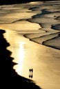 Walking on the beach with sunset light