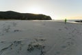 Walking on the beach at sunset