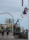 Walking on the Boardwalk to the Sky Wheel in Myrtle Beach Royalty Free Stock Photo