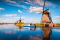 Walking boat on the famous Kinderdijk canal with windmills. Royalty Free Stock Photo