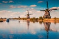Walking boat on the famoust Kinderdijk canal with windmills. Royalty Free Stock Photo