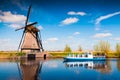 Walking boat on the famoust Kinderdijk canal with windmills Royalty Free Stock Photo