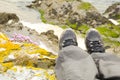 Walking boots with beach in background