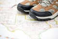 Walking boots on world map Royalty Free Stock Photo