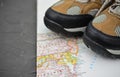 Walking boots on world map and Royalty Free Stock Photo