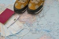 Walking boots on world map and face mask passport thermometer . Stop spreading coronavirus Royalty Free Stock Photo