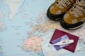 Walking boots  with world map passport thermometer insurance card face mask. Stop Covid-19. Royalty Free Stock Photo