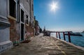 Walking on the bridges of the old city of Venice. Bright sun. The beauty of the ancient city. Italy