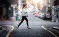 Walking, business and a woman crossing a street in the city while in a rush or late for work. Road, pedestrian and Royalty Free Stock Photo