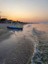 Walking catamaran against the backdrop of sunrise on the sea.