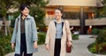 Walking, conversation and business women in the city talking for communication or bonding. Smile, discussion and Royalty Free Stock Photo