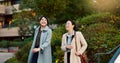 Walking, conversation and business women in the city talking for communication or bonding. Smile, discussion and Royalty Free Stock Photo