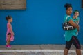 Walking Cuban people woman and daughter in street of Caribbean communism Cuba, America