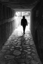 Walking in a dark tunnel. Black and white photo Royalty Free Stock Photo