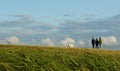 Walking with a dog - 3 friends in a meadow in Rugen