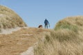 Walking with a dog in Holmsland Klit - Denmark.