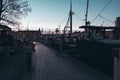 Walking down a small pier at sunset with lots of small boats, Stockholm Sweden Royalty Free Stock Photo