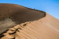 Walking a dune in Sossusvlei, Namibia