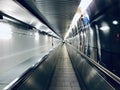 Walking escalators in an airport tunnel unique photo