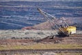 Walking excavator, railway track on the background of part of the iron ore quarry. Background