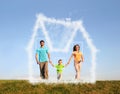 Walking family with boy and dream cloud house Royalty Free Stock Photo