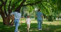 Walking family find place for picnic back view. Active leisure on nature concept Royalty Free Stock Photo
