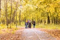 Walking family with three children in autumnal park Royalty Free Stock Photo