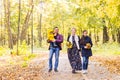 Walking family with two children in autumnal park Royalty Free Stock Photo