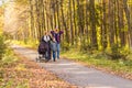 Walking family with two children in autumnal park Royalty Free Stock Photo