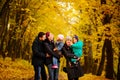 Walking family with two children in autumnal park Royalty Free Stock Photo