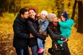 Walking family with two children in autumnal park Royalty Free Stock Photo