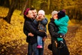 Walking family with two children in autumnal park Royalty Free Stock Photo