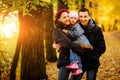 Walking family with two children in autumnal park Royalty Free Stock Photo