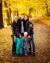 Walking family with two children in autumnal park Royalty Free Stock Photo