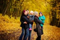 Walking family with two children in autumnal park Royalty Free Stock Photo