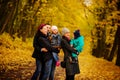 Walking family with two children in autumnal park Royalty Free Stock Photo