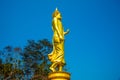 Walking golden buddha statue at Phra That Khao Noi temple